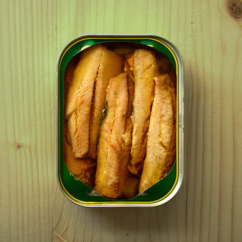 Can of sardines on a wooden surface