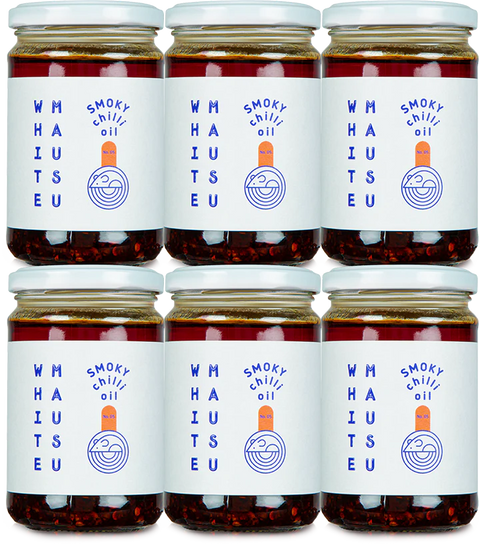 Six jars of White Mausu Smoky Chilli Oil on a white background
