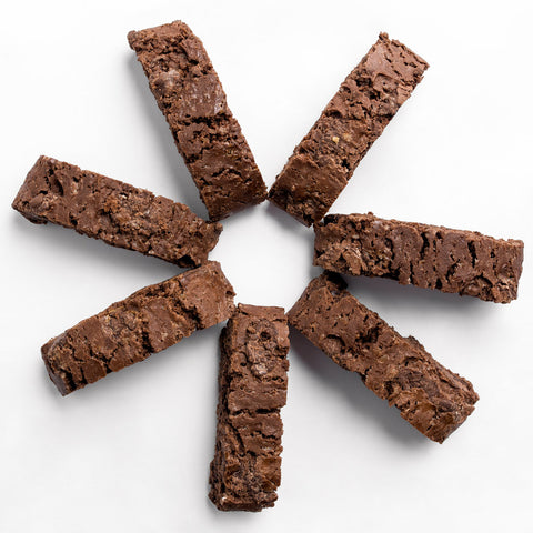 Six chocolate brownie bars arranged in a circular pattern on a clean white background.