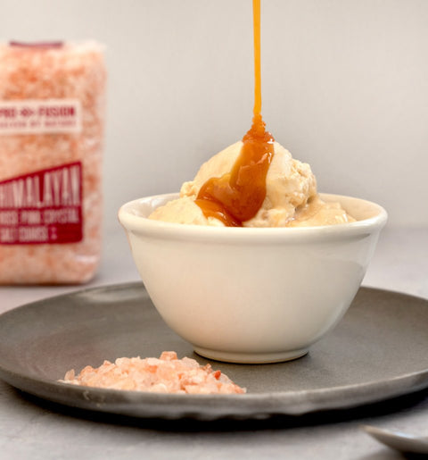 ice cream with Himalayan pink salt on a plate and bag of salt in background