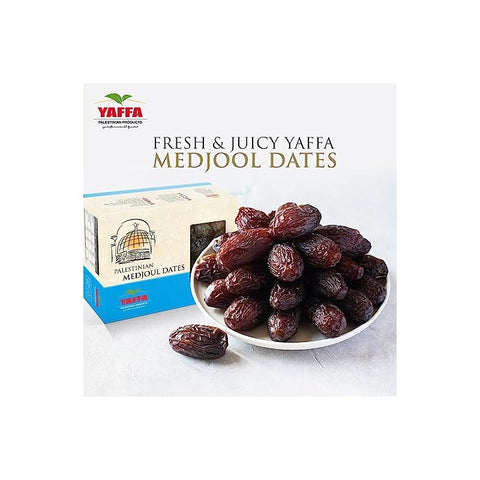 plate of dates in front of box of palestinian medjoul dates on white background