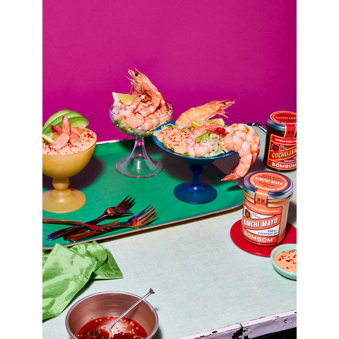 Shrimp dishes with condiments on a colorful background